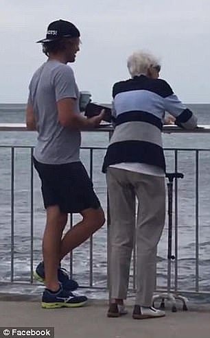 A heartwarming photo showing a mystery man accompanying a woman, who is seemingly his elderly grandmother, to visit a popular Sydney beach each week has set social media alight