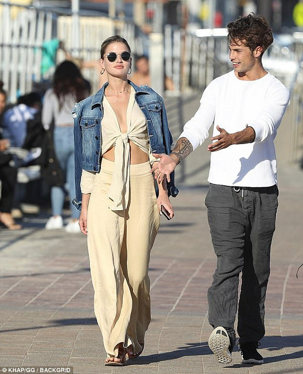 ABS-olute babe! She flashed a hint of cleavage and her taut stomach in the revealing number, as she headed out for a lunch date with her boyfriend Nicolo 