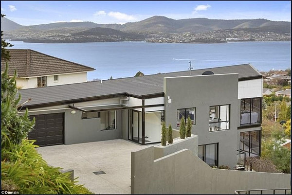 The median price for a Sydney home would nab this five-bedroom mansion with glorious views overlooking Sandy Bay in Hobart
