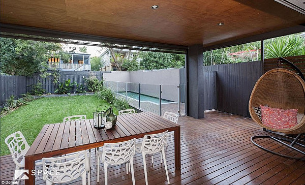 With a spacious backyard, swimming pool, deck and plenty of open space inside, the property in Brisbane sure beats a cramped terrace