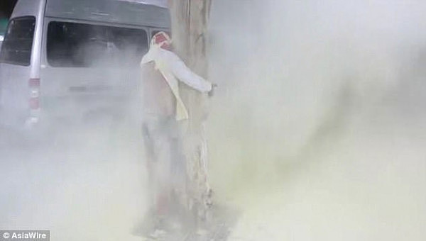 Groom is  covered in white smoke as his friends play a joke on him on his wedding day, in 