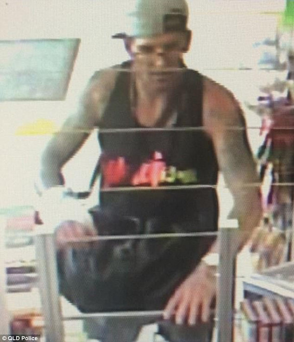 A search is underway for a tattooed man who told a Gold Coast service station employee on Thursday he had hidden a child in his bag (pictured)
