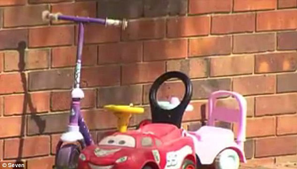 The girl was allegedly raped and tortured at her house on Thursday (pictured are toys outside the Capalaba home)