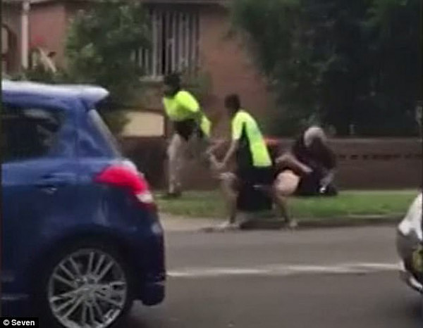 Confronting footage, filmed by witnesses, showed a man in a high-vis yellow shirt punching victim Nazih Zahoo on the footpath while another man dressed in black helped 