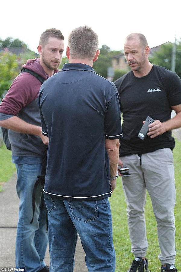 Moorhouse (centre, back to camera) filmed 200 people including children using cameras under the sink