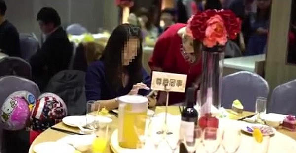 Came uninvited: The alleged wedding crasher is  asked to leave a lavish restaurant in Taiwan