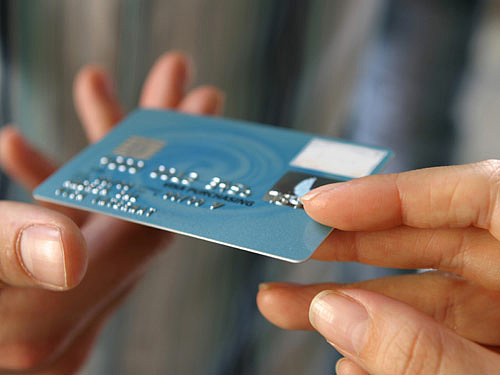 547ede894e055_-_hand-passing-credit-card-large-new.jpg,0