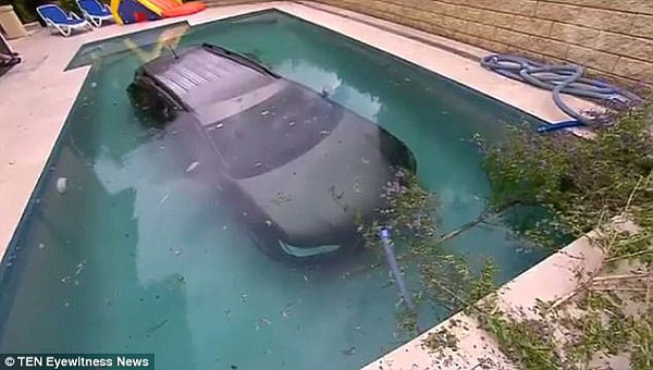 A car rolled into a backyard pool (pictured) after the driver forgot to put the handbrake on