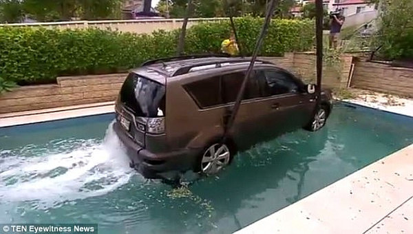 The Mitsubishi Outlander SUV rolled forward and became submerged in the pool