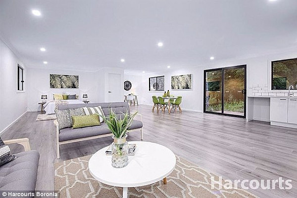 The five-bedroom home in the picturesque leafy suburb of The Basin includes a large open-plan living and kitchen area overlooking the tranquil bushland