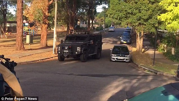 Police were seen storming properties in Telopea and Regents Park early on Thursday morning