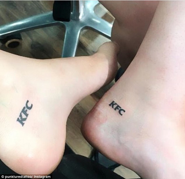 Two girls sporting fresh ink of the KFC logo are sure impress their friends at the next party