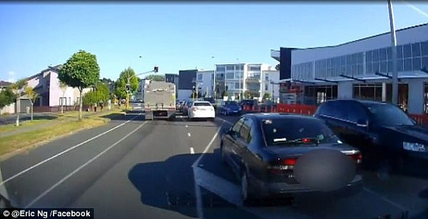 Mr Ng then pulls in behind the woman, who is driving a black Subaru