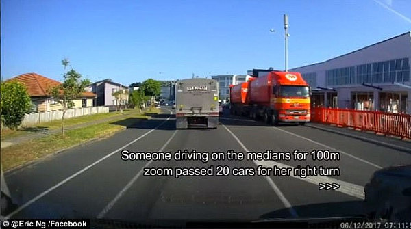 The woman's car can be seen overtaking Mr Ng on the right hand side in the flush median strip