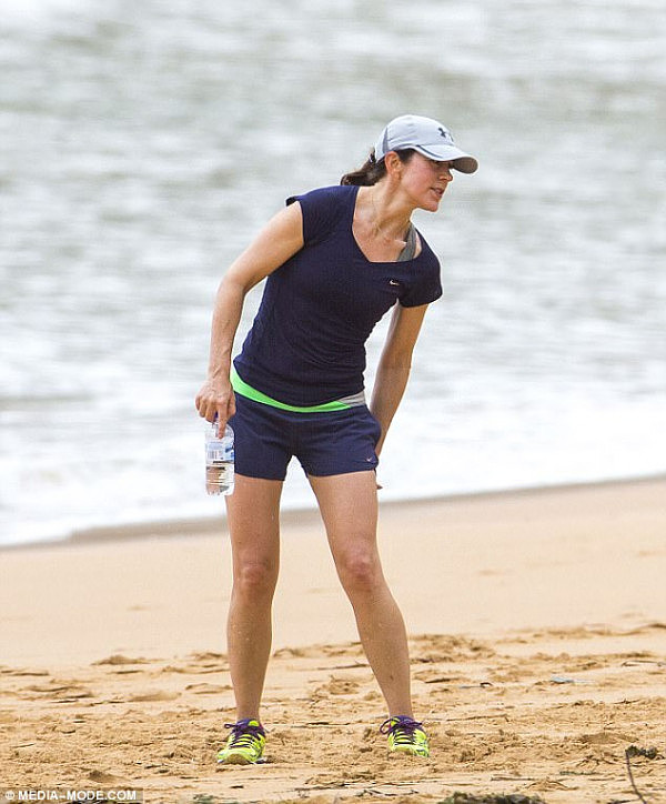 For the cloudy but warm Friday morning, Princess Mary sported a V-neck blue T-shirt by Nike, a pale blue cap by Under Armour, Nike navy shorts and bright-coloured trainers (pictured) 