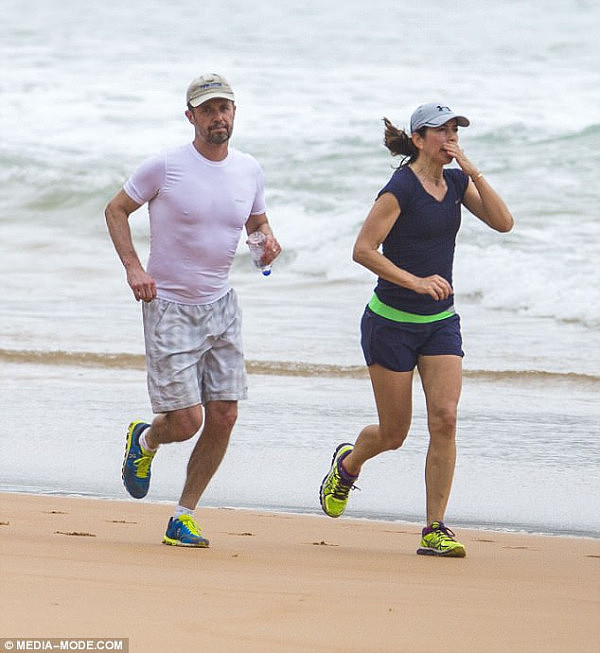 Her husband, Prince Frederik, meanwhile, opted for a checked pair of shorts, neutral-coloured cap and white T-shirt (pictured with Princess Mary)