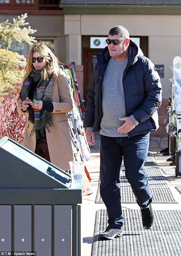Stroll: Packer and the woman were all smiles, seen leaving together, before enjoying a short stroll along the ski resort's highly trafficked path