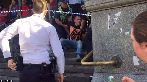 A 24-year-old man wearing jeans and a Nike t-shirt (pictured) was arrested on the steps at Flinders Street Station shortly after the incident. He was released on Friday morning and is expected to be charged with cannabis possession
