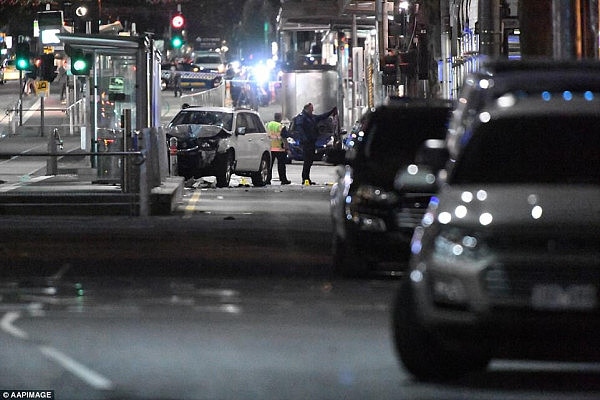 Usually a busy strip in the heart of the city, Flinders Street has become a crime scene (pictured) after the car ploughed crowds