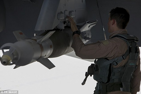 4782A1A200000578-5204407-A_Super_Hornet_air_combat_officer_checks_armaments_on_his_aircra-a-14_1513907149145.jpg,0