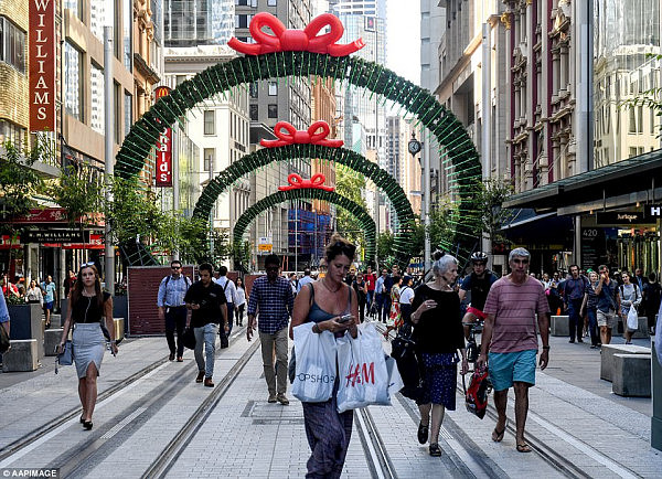 The newly-opened section of George Street (pictured) outside the Queen Victoria Building has arches lit like bows on presents and lights cover Pitt Street Mall 