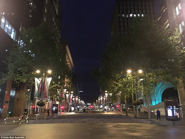 Martin Place looks gloomy and dark in the lead up to Christmas, hanging banners the only sign of the festive season 