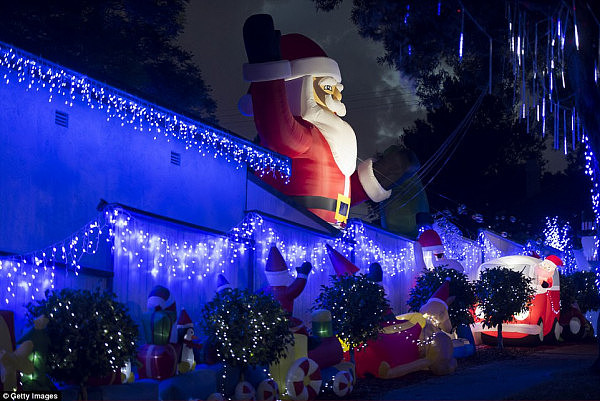 . From blow-up gingerbread houses and huge Santa Clauses to delicate models of reindeer, the leafy streets have come alive just in time for Christmas (pictured is a Mosman home)