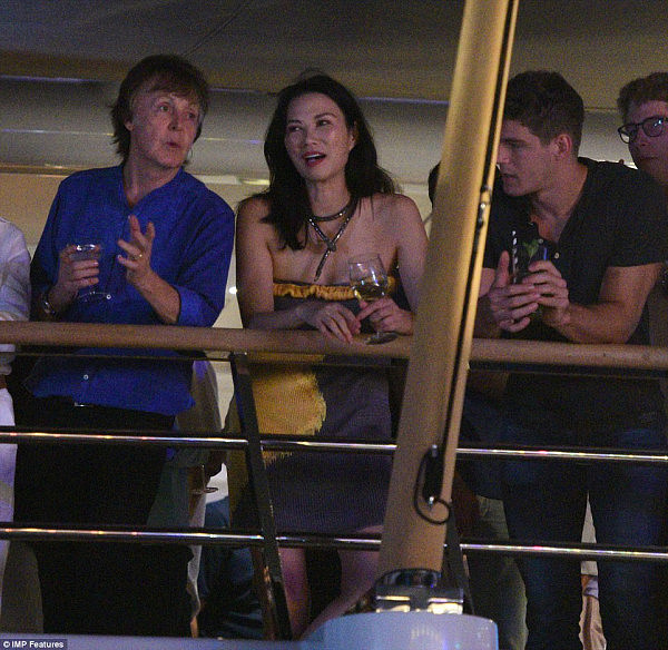 Sharing laughs: Former Beatles frontman Sir Paul McCartney (left) and Wendi Deng (centre) seemed to hit it off on deck