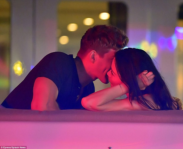 Pictures show the young Hungarian model Bertold Zahoran leaning in to kiss Wendi Deng as the couple partied on board the yacht