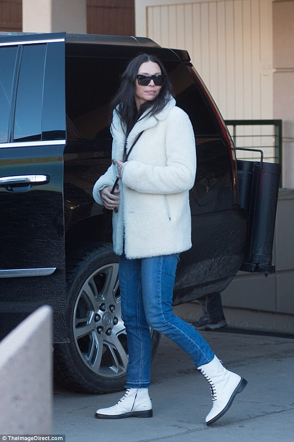 Snow queen: Erica looked as though she had come well prepared for the wintry Colorado temperatures, as she wore a fluffy white jacket and Dr Martens boots in a matching hue