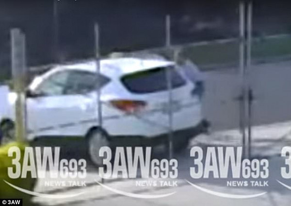 CCTV footage shows the owner of a white Hyundai 4WD step out of his car to lock the gates of a business just before the thief struck