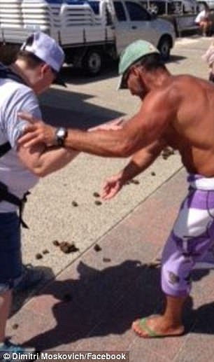 Dimitri Moskovich warns a tourist before he steps in horse manure left on Bondi Beach