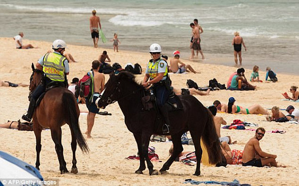Mounted police patrol Bondi Beach which some locals say is being fouled by horse droppings