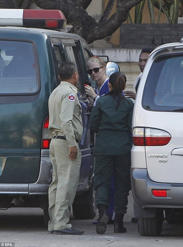 Charles (second from left) arrives at the Appeal Court in Phnom Penh, Cambodia, 08 January 2018