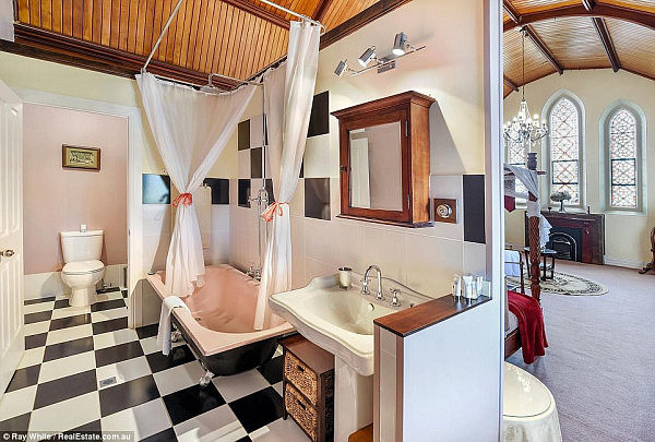 This bathroom, one of a dozen the property boasts, leads directly to one of the 14 bedrooms the stunning home includes