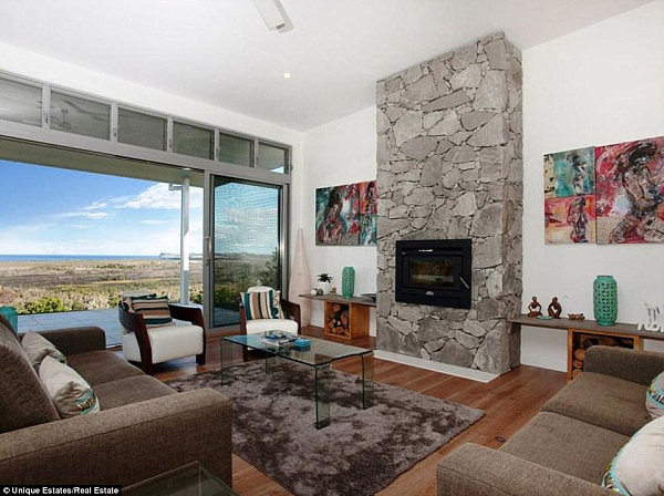 Statement piece: The spacious living area features a stone fireplace at its centre 