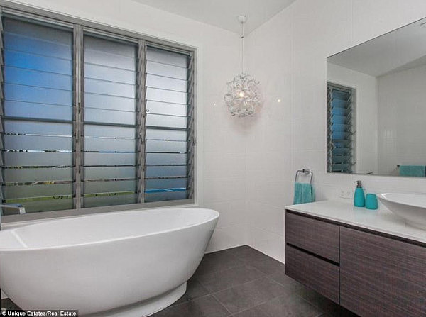 Modern design: The property has two bathrooms featuring a large sink and bathtub 