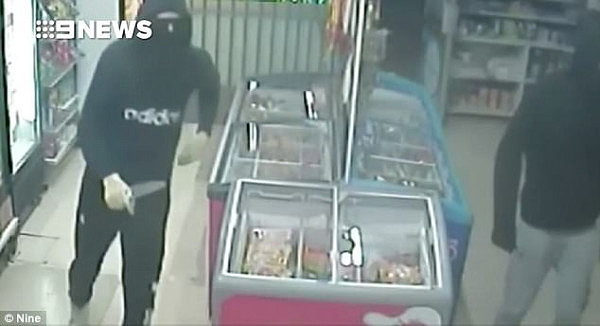 Knife-wielding thieves wearing balaclavas and hooded jumpers threatened a woman shopkeeper before robbing a western Sydney convenience store