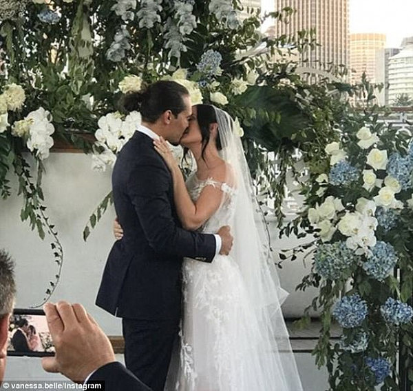 The boat was adorned with multiple white and blue flower arrangements from Azariade Floral Stylist