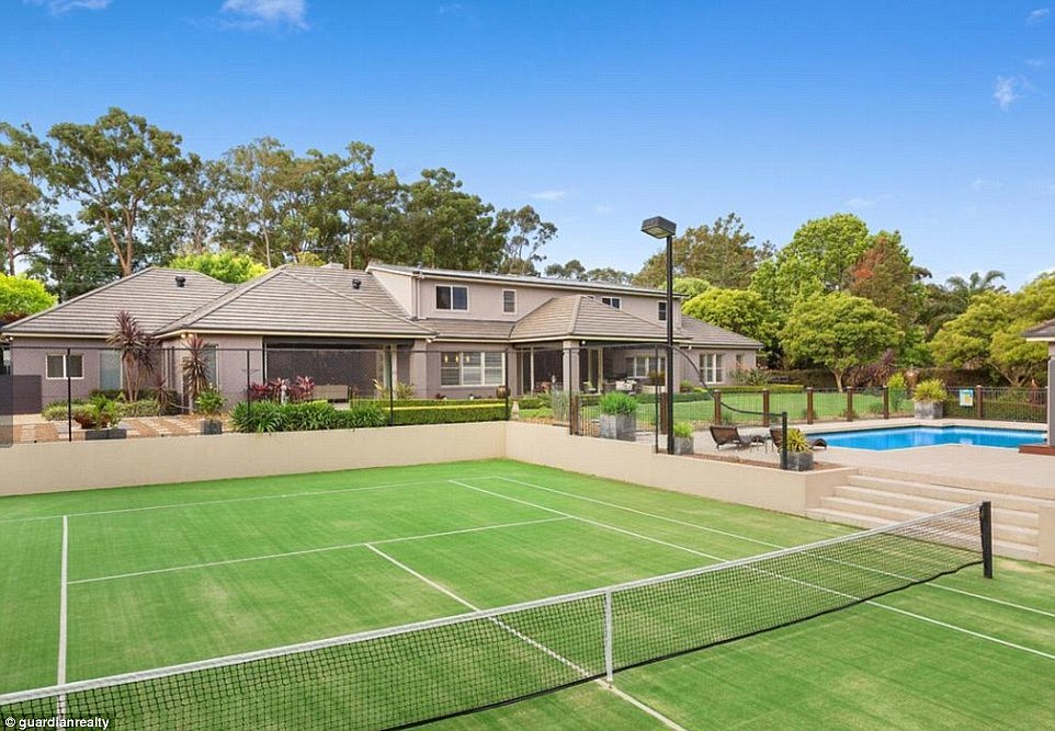 Making a splash! In the backyard, a plunge pool takes pride of place next to a tennis court