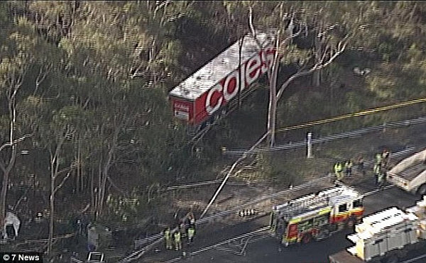 4A06E9CF00000578-0-A_man_is_dead_after_a_collision_between_a_ute_and_a_Coles_truck_-m-3_1520842468435.jpg,0