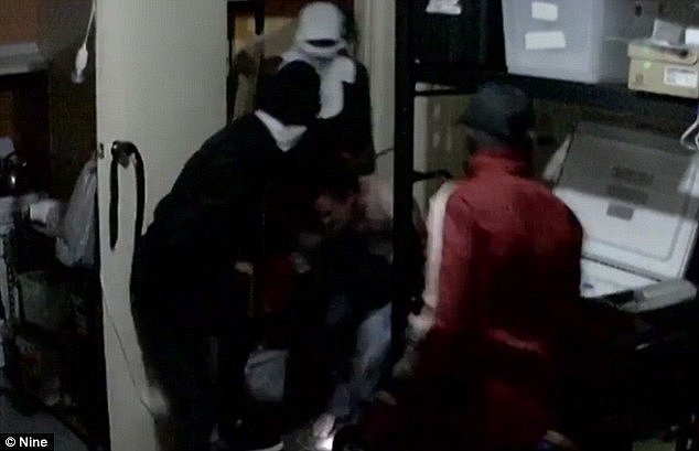 Shocking security footage reveals the moment a gang of African thugs allegedly stormed into a disability pensioner's home and bashed him with a wooden plank