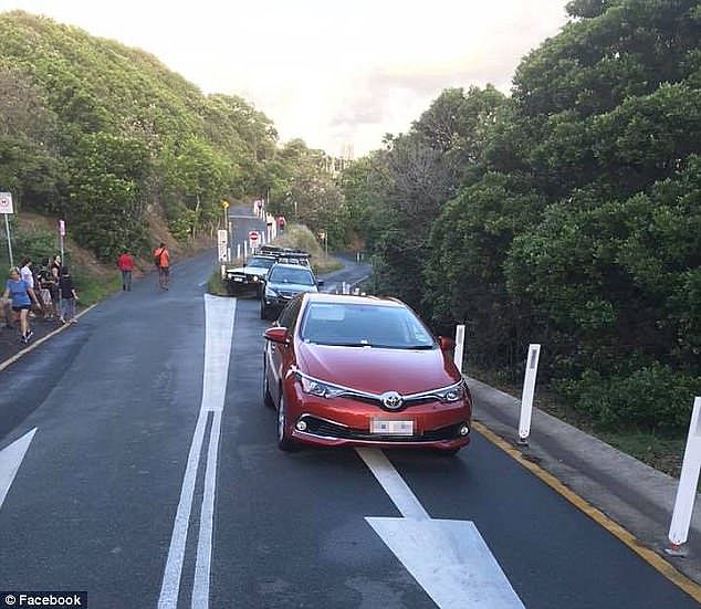 A photo posted to Facebook, taken on Lighthouse Drive, shows empty cars parked directly in the middle of one lane and blocking access for others