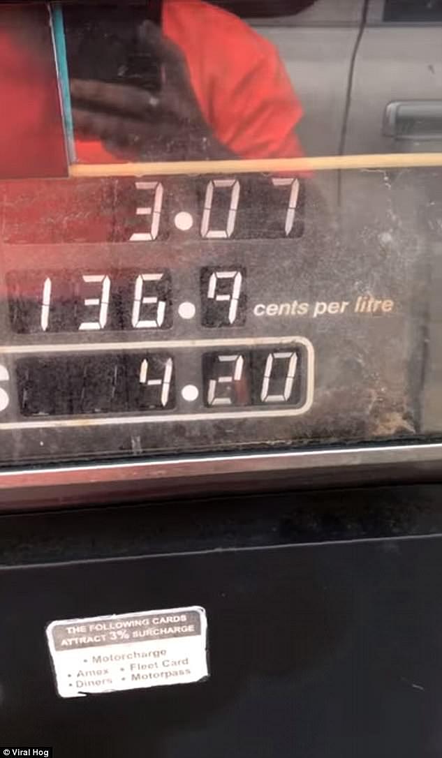 The driver, who stopped to fill up his four-wheel drive, filmed the incident to show the price of petrol increase more than $1 in 10 seconds (pictured)