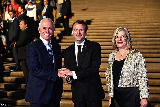 President of France Emmanuel Macron (centre) meets with Australia's Prime Minister Malcolm Turnbull (left) and his wife Lucy Turnbull