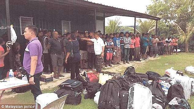 Three Indonesians and four Malaysians were arrested after police raided a fishing boat transferring the immigrants