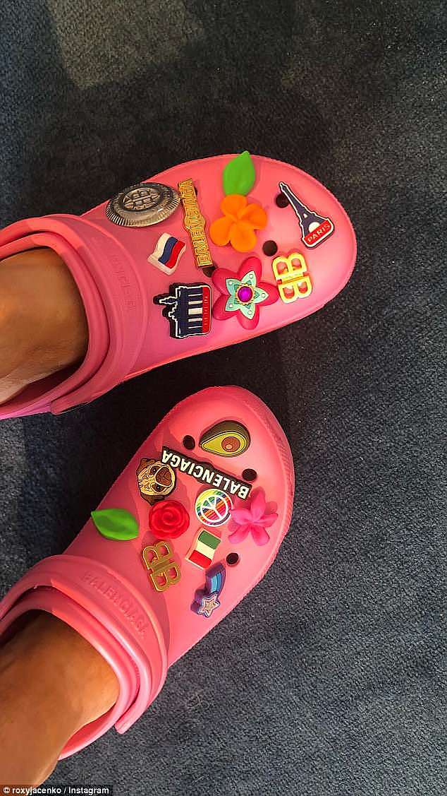 Charmed life? In a close-up snap, fans could see the various charms - including a pug, a shooting star, flowers, the Eiffel Tower and an avocado - that adorned the shoes
