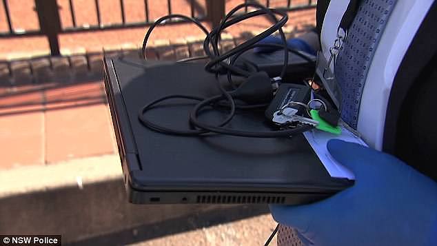 Pictured is a laptop allegedly seized by police during the arrest of an alleged paedophile, 48