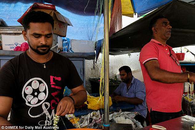 Flower stall operator Kareik (right) said he 'totally' does not agree with the death sentence and thinks drug runners should get 'maybe a few years' in prison