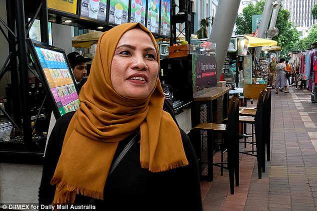'I'm against the death penalty because you are just a human being and you can make mistakes,' shopkeeper Norifah Samd (pictured) said